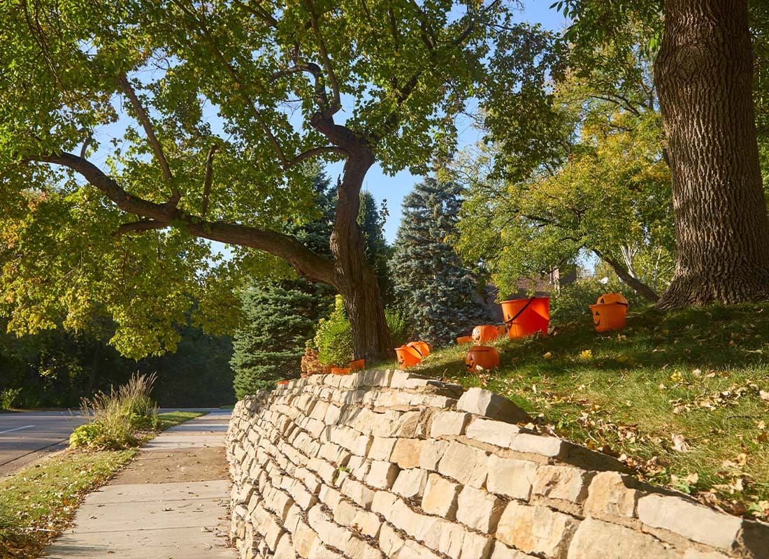 Medina, MN - Sidewalk Near a Stone Wall on a Sunny Day in October in My Neighborhood Near Minneapolis Minnesota
